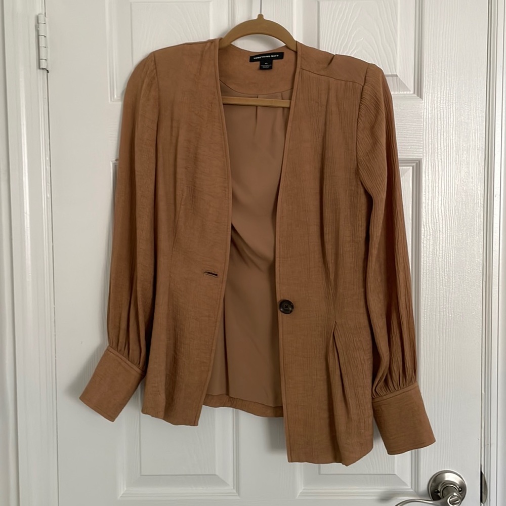 Tan colored form fitting long sleeve designer blazer by something navy